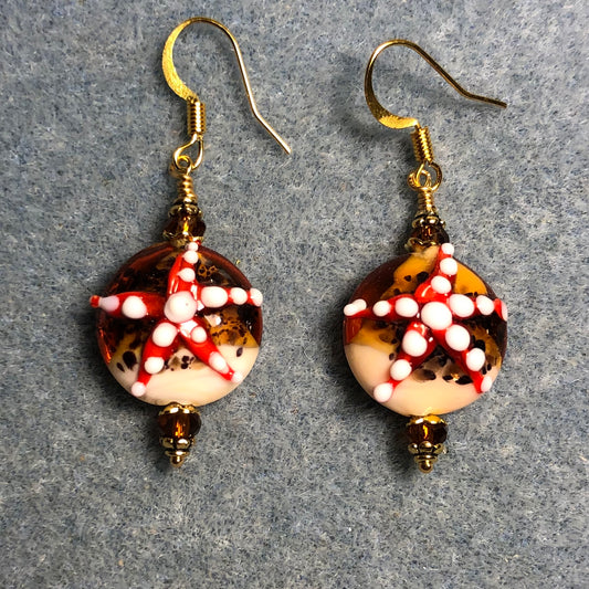 Amber, red, and tan lamp work starfish bead earrings adorned with amber Chinese crystal beads.