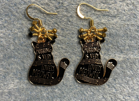 Black and gold enamel musical cat charm earrings adorned with tiny dangling black and gold Chinese crystal beads.
