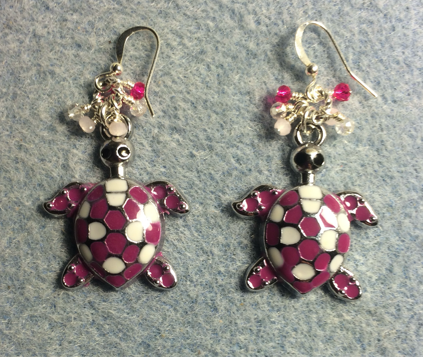 Large hot pink and white enamel turtle charm earrings adorned with small dangling hot pink and light pink Czech glass beads.