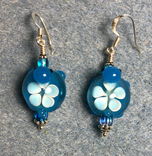 Turquoise lamp work turtle bead earrings adorned with turquoise Czech glass beads.