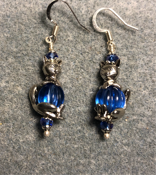 Silver cat bead cap earrings adorned with large blue Czech glass beads and blue Chinese crystal beads.