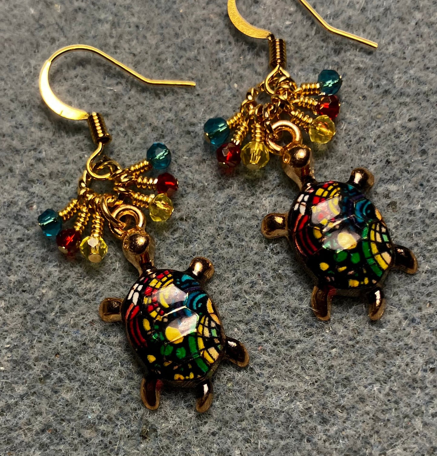 Turquoise, red, and yellow enamel turtle charm earrings adorned with tiny dangling turquoise, red, and yellow Chinese crystal beads.