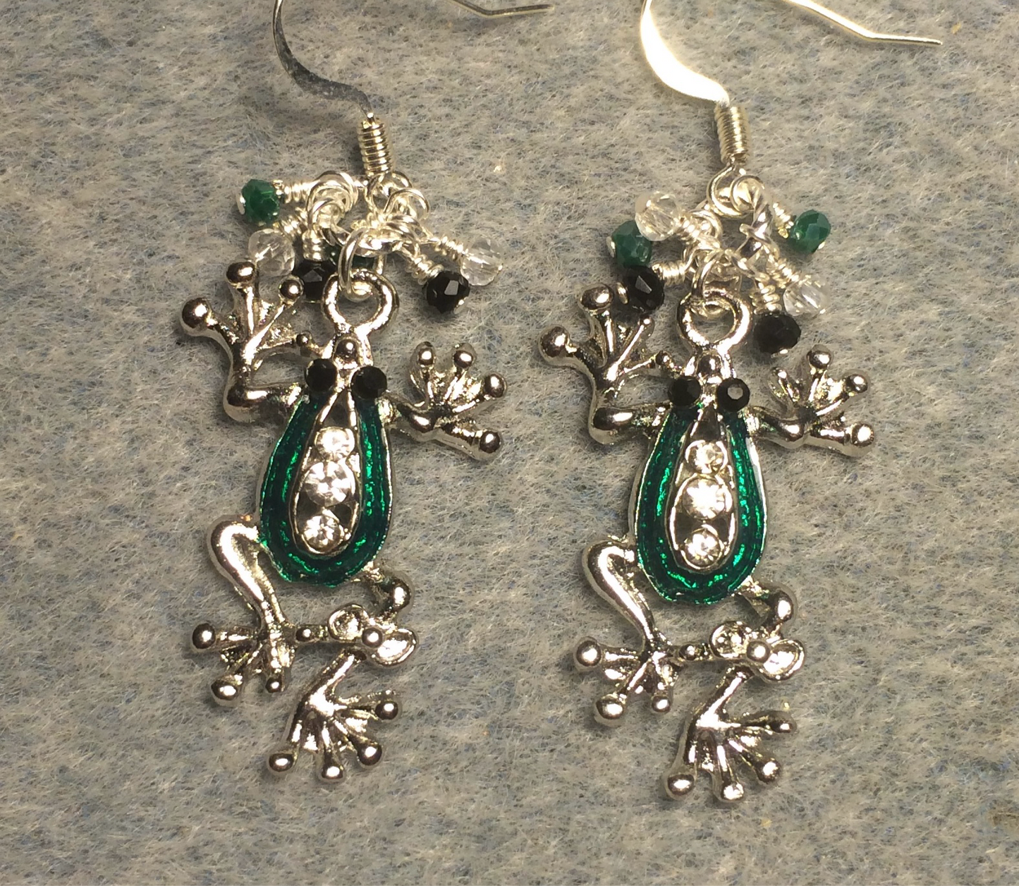 Silver and green enamel and rhinestone frog charm earrings adorned with tiny dangling green, black, and silver Chinese crystal beads.