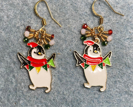 White, red, and green enamel silly penguin charm earrings adorned with tiny dangling white, red, and green Chinese crystal beads.