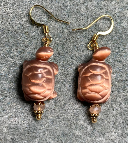 Peach fiber optic (cat’s eye) turtle bead earrings adorned with peach Chinese crystal beads.