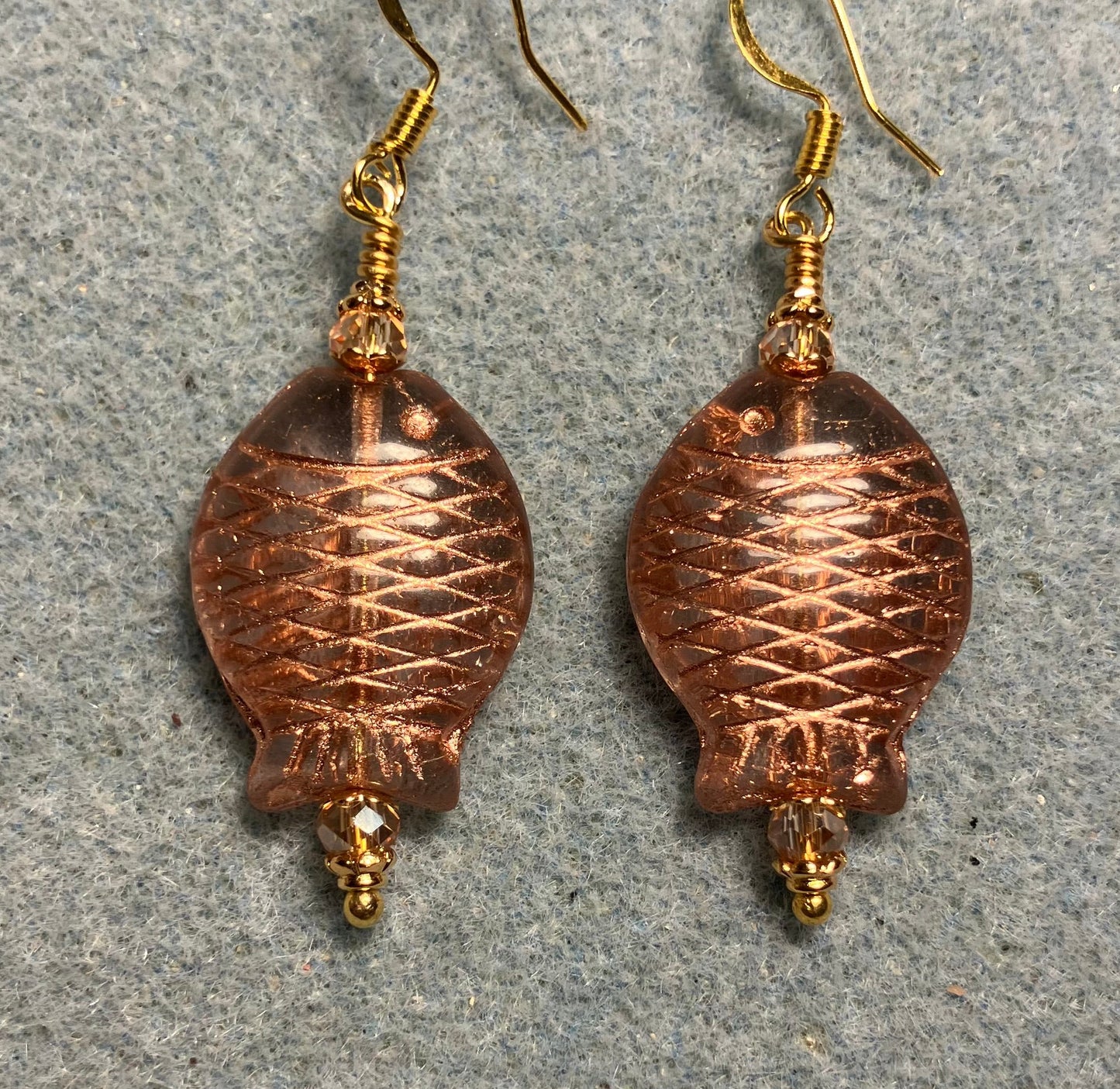 Clear and gold Czech glass fish bead earrings adorned with gold Chinese crystal beads.
