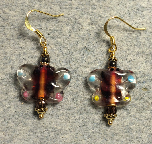 Brown and light blue lamp work butterfly bead earrings adorned with brown Czech glass beads.