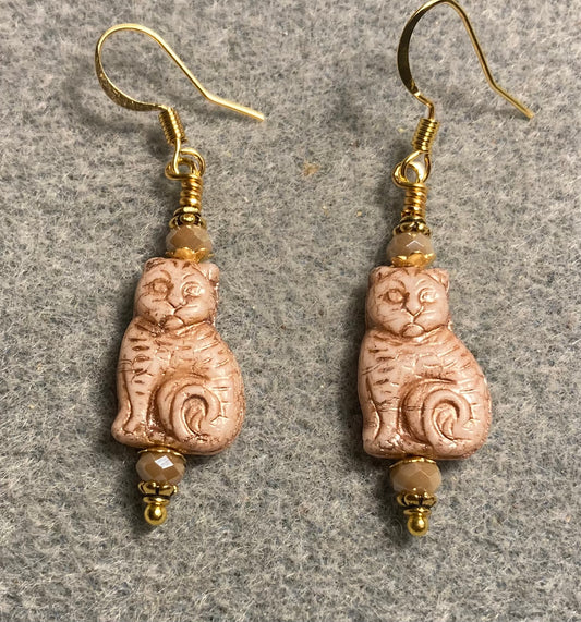 Medium beige (with gold inlay) Czech glass cat bead earrings adorned with beige Chinese crystal beads.