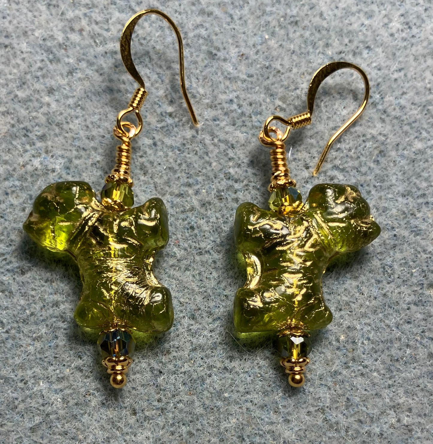 Olive green (with gold wash) Czech glass Schnauzer bead earrings adorned with sparkly olive green Chinese crystal beads.