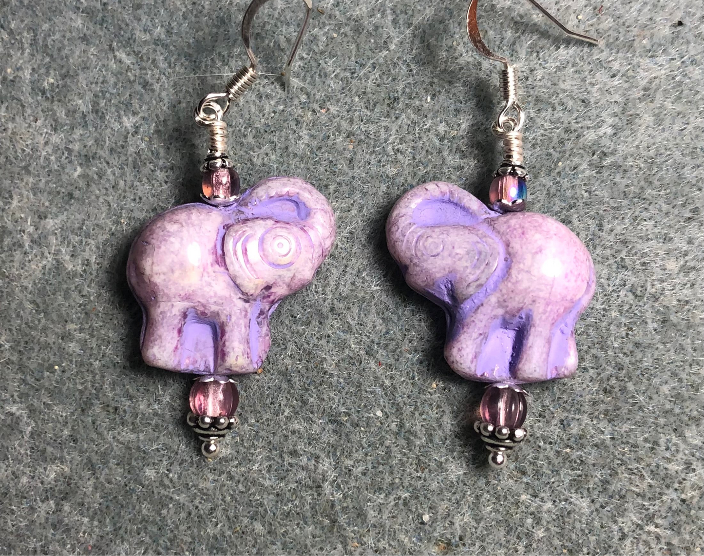 Light purple Czech glass elephant bead earrings adorned with light purple Czech glass beads.