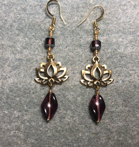 Gold lotus flower connector charm earrings adorned with violet Czech glass twist beads and violet Czech glass beads.