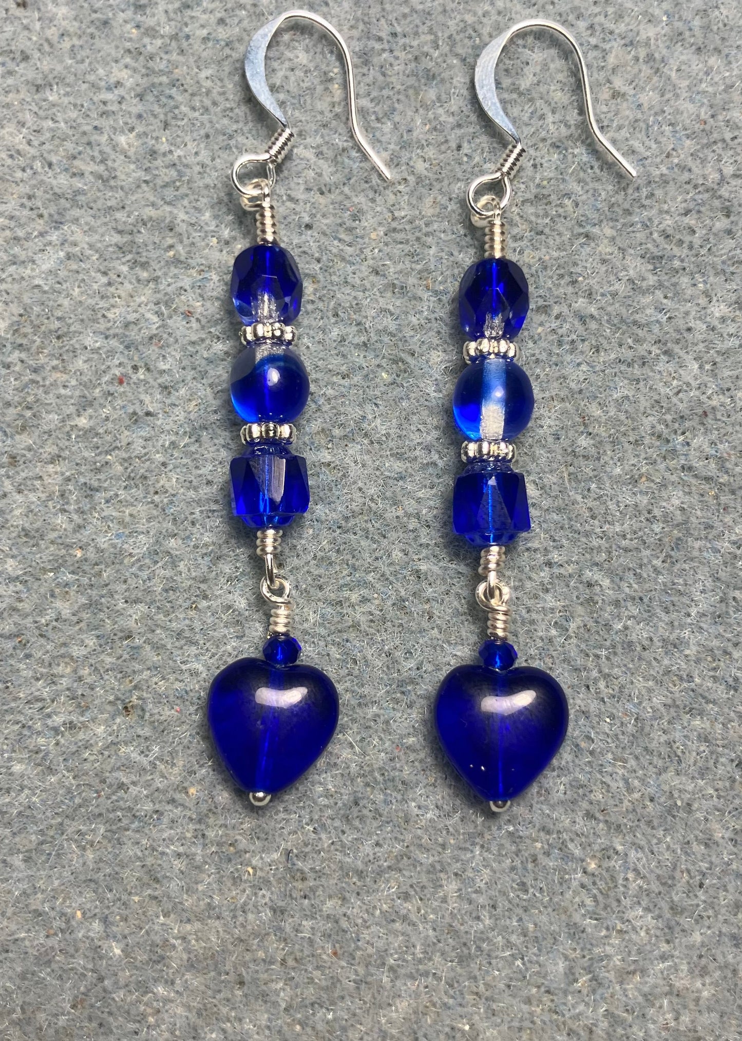 Small dark blue Czech glass heart bead earrings adorned with dark blue Czech glass beads.