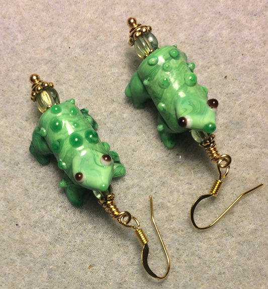 Kelly green lamp work bumpy toad bead earrings adorned with green Czech glass beads.