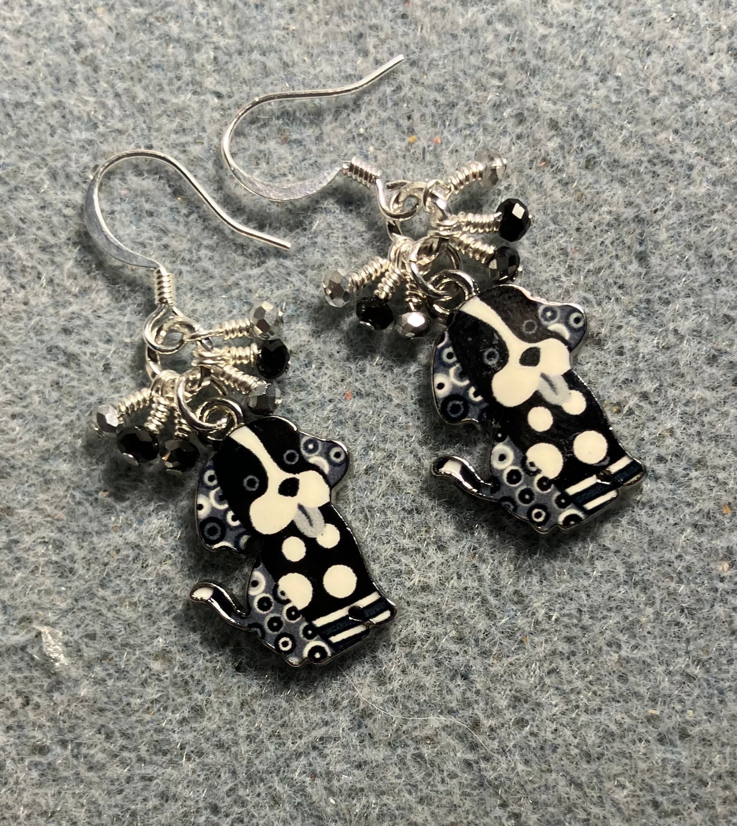 Black and white enamel silly dog charm earrings adorned with tiny dangling hot pink and black and silver Chinese crystal beads.