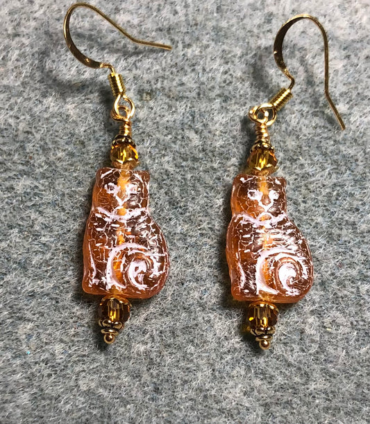 Medium amber (with white inlay) Czech glass cat bead earrings adorned with amber Chinese crystal beads.