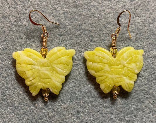 Large yellow jade gemstone butterfly bead earrings adorned with yellow Chinese crystal beads.