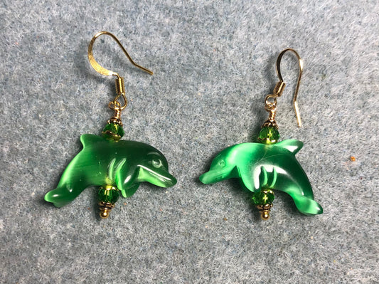 Green fiber optic (cat’s eye) gemstone dolphin bead earrings adorned with green Chinese crystal beads.