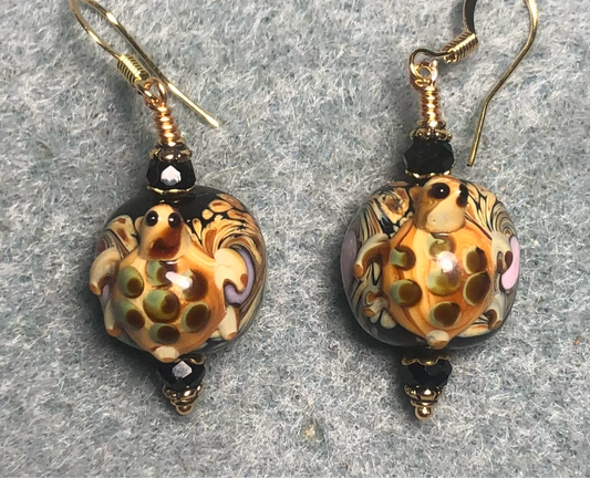 Black and brown lamp work turtle bead earrings adorned with black Chinese crystal beads.