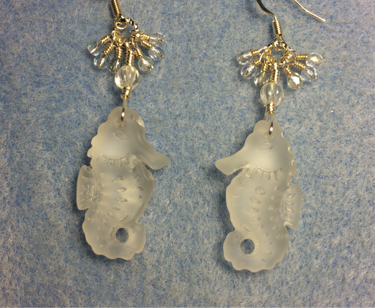 Clear sea glass seahorse pendant bead earrings adorned with clear Czech glass beads and small dangling clear Czech glass beads.