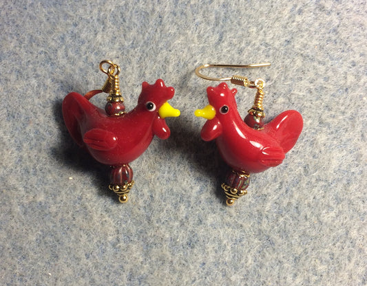 Bright red lamp work chicken bead earrings adorned with red Czech glass beads.