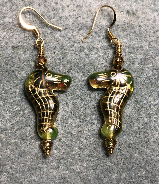 Green (with gold inlay) Czech glass seahorse bead earrings adorned with sparkly green Chinese crystal beads.