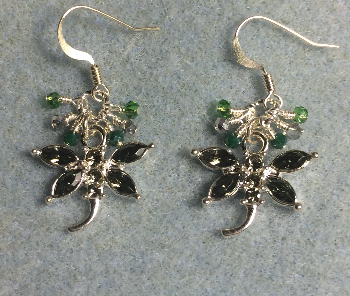 Gray green and silver rhinestone dragonfly charm earrings adorned with tiny dangling green and silver Chinese crystal beads.