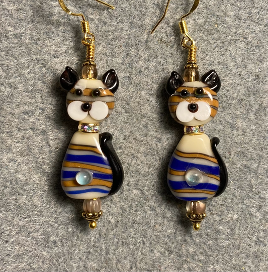 Brown and blue lamp work striped two piece cat bead earrings adorned with clear rhinestone “collars” and tan Czech glass beads.