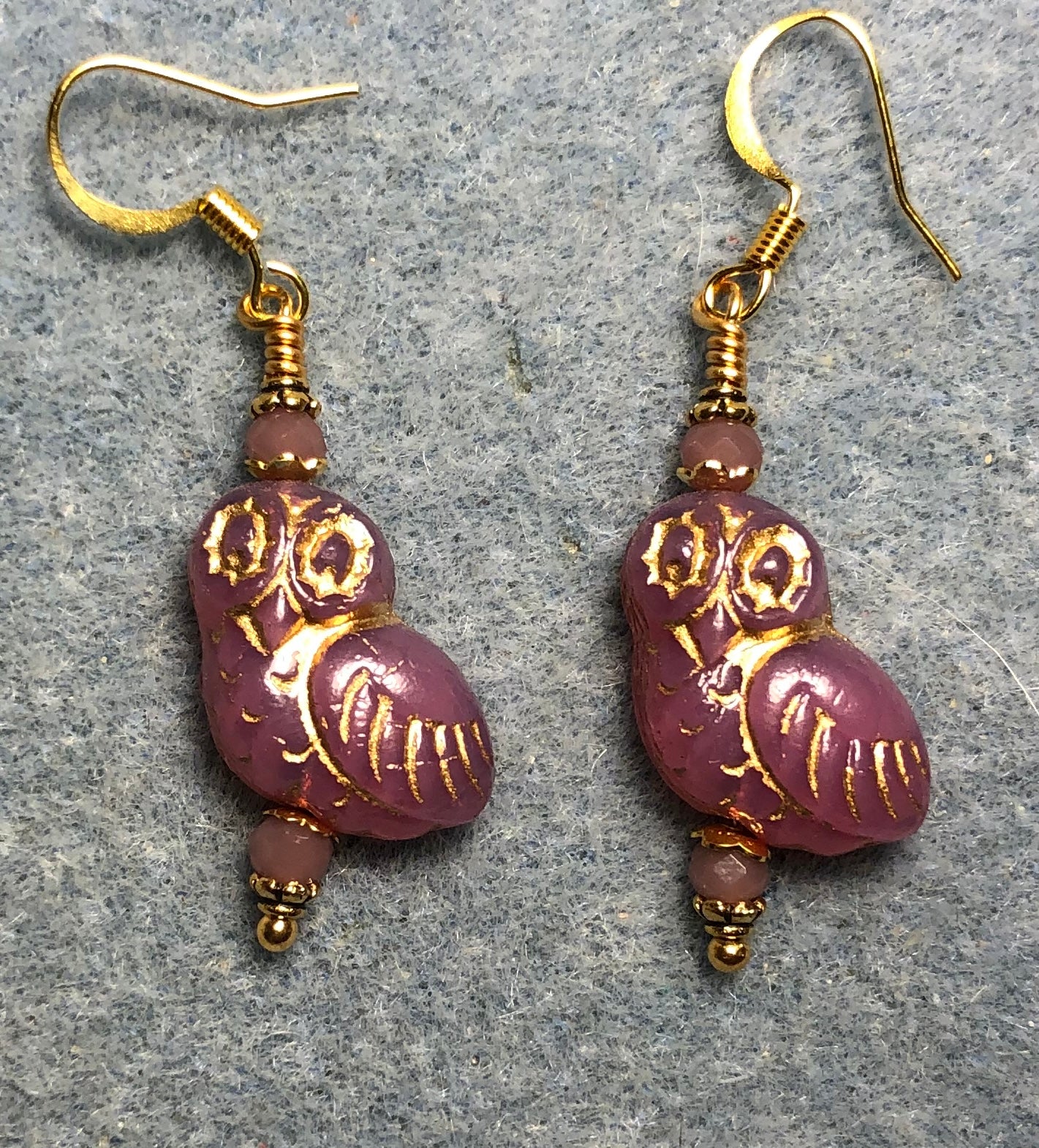 Mauve pink (with gold wash) fancy Czech glass owl bead earrings adorned with mauve pink Chinese crystal beads.