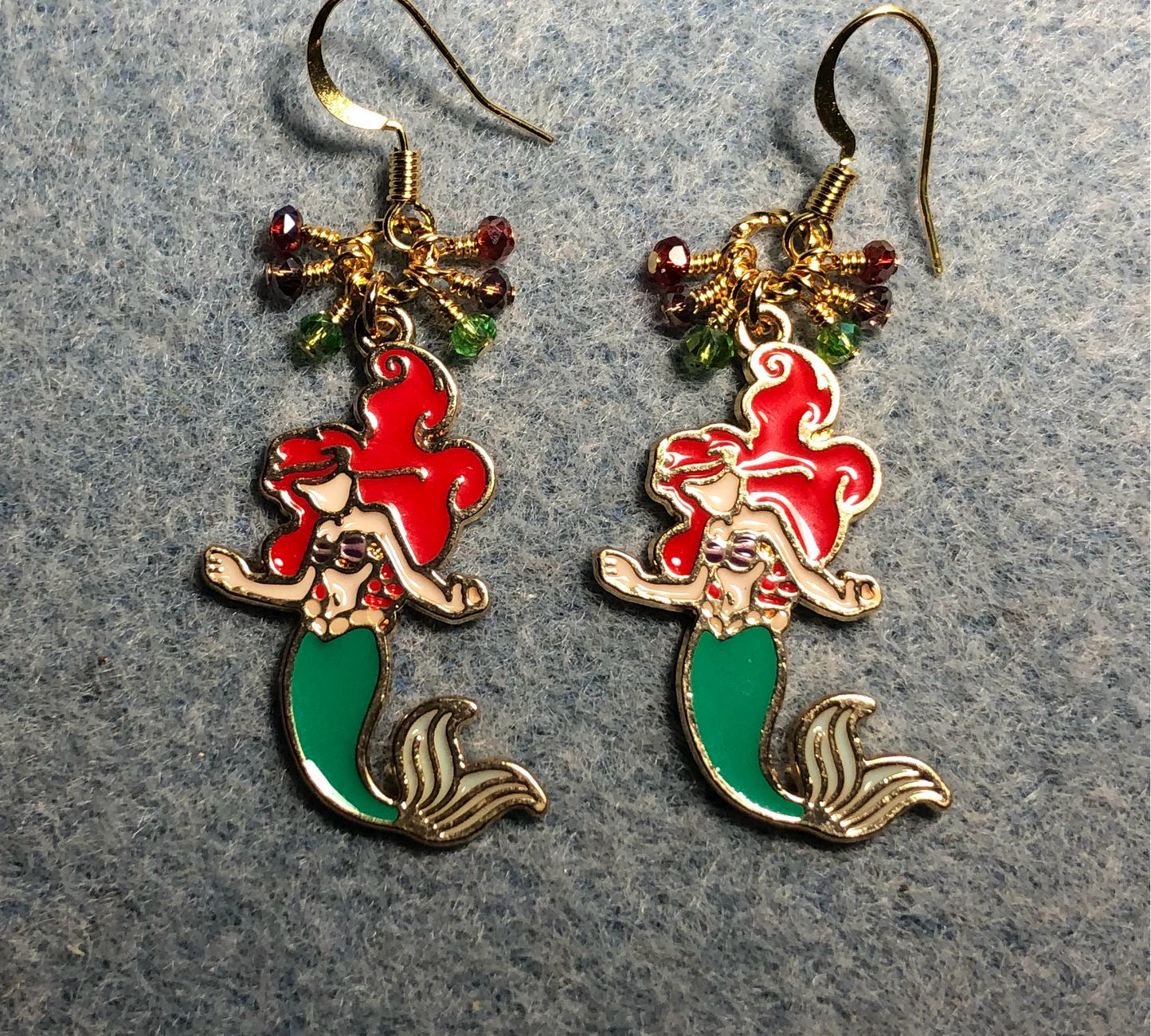 Red, green, and purple enamel mermaid charm earrings adorned with tiny dangling red, green, and purple Chinese crystal beads.