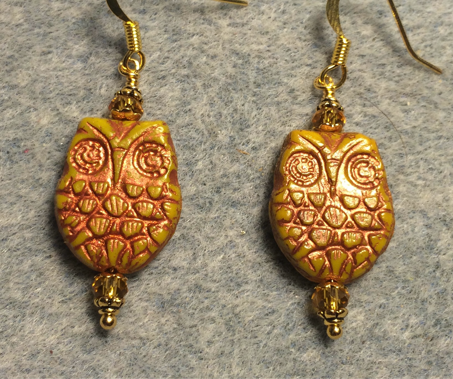 Mustard yellow (with copper wash) Czech glass owl bead earrings adorned with topaz Chinese crystal beads.
