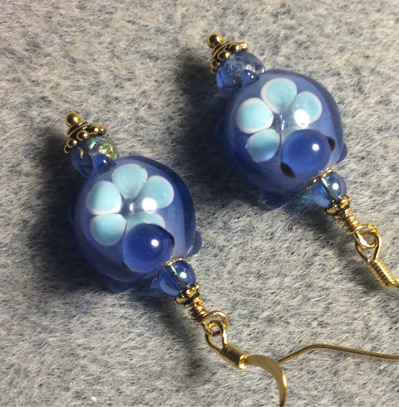 Dark blue and light blue lamp work turtle bead earrings adorned with dark blue Czech glass beads.