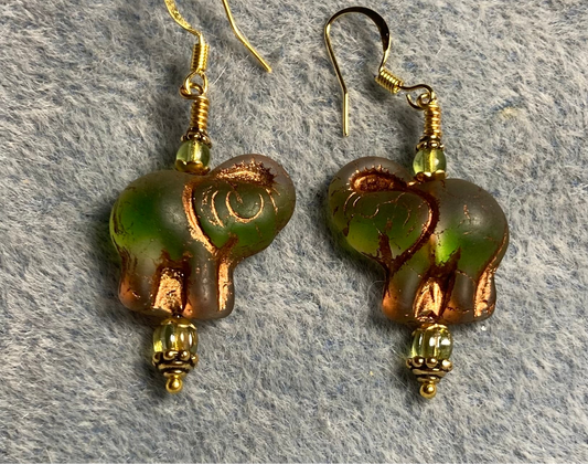 Translucent green (with copper inlay) Czech glass elephant bead earrings adorned with lime green Czech glass beads.