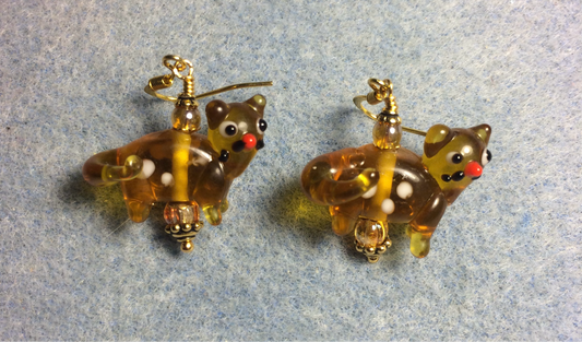 Translucent amber lamp work spotted cat bead earrings adorned with amber Czech glass beads.
