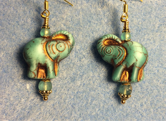 Light aqua matte (with copper inlay) Czech glass elephant bead earrings adorned with aqua Czech glass beads.