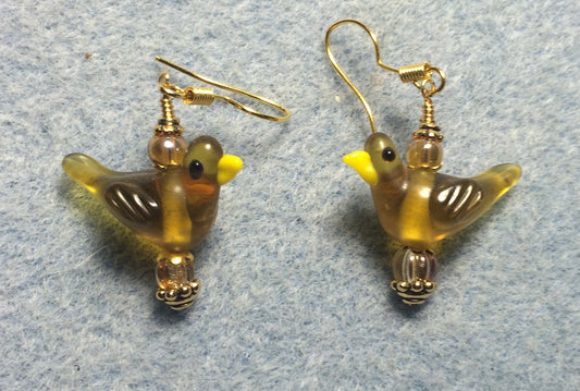 Translucent amber lamp work songbird bead earrings adorned with amber Czech glass beads.