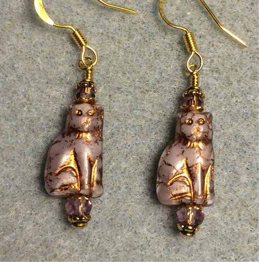 Small violet (with gold inlay) Czech glass cat bead earrings adorned with violet Chinese crystal beads.