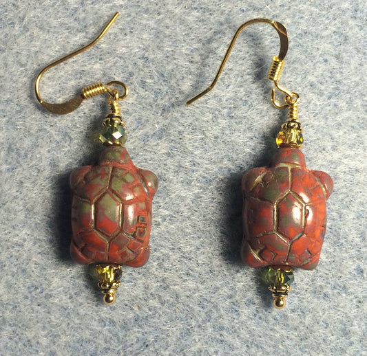 Orange green Picasso Czech glass turtle bead earrings adorned with olive green Chinese crystal beads.