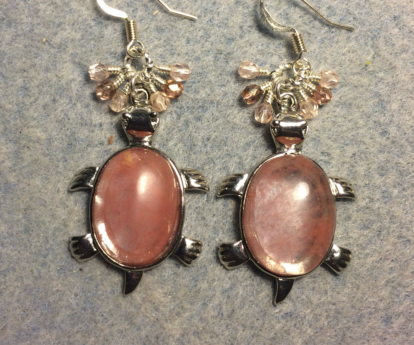 Large silver and rose quartz gemstone turtle charm earrings adorned with small dangling rose and pink Czech glass beads.