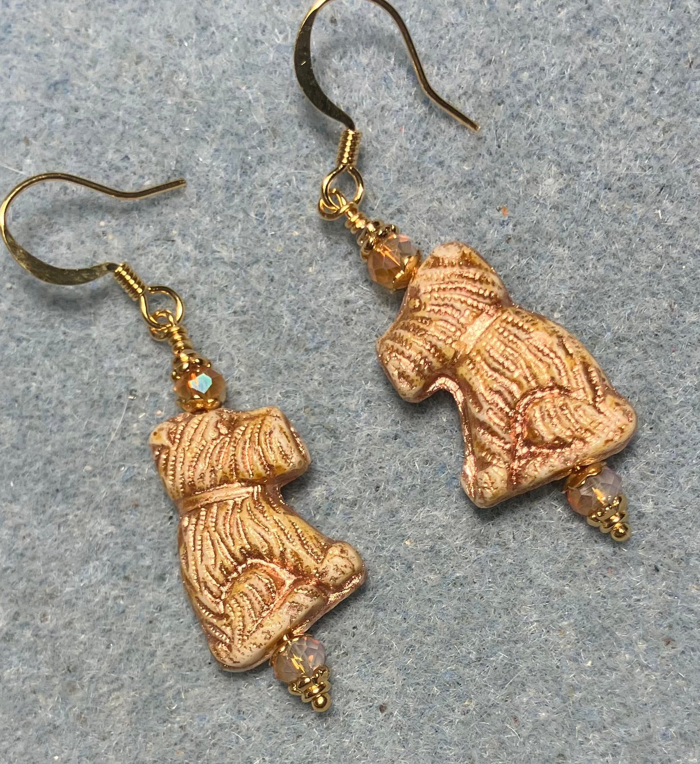 Gold Czech glass Schnauzer bead earrings adorned with gold Chinese crystal beads.