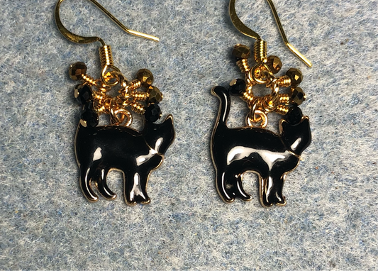 Small black enamel cat charm earrings adorned with tiny dangling black and gold Chinese crystal beads.