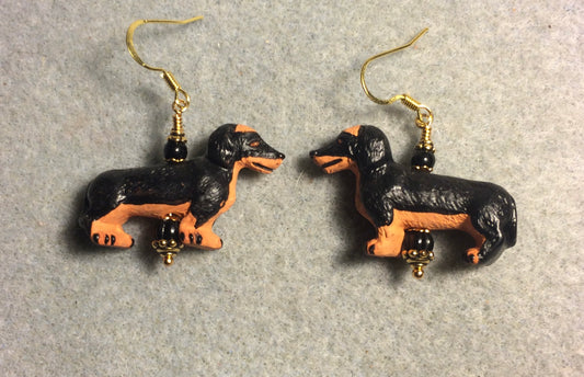 Black and brown ceramic dachshund bead earrings adorned with black Czech glass beads.