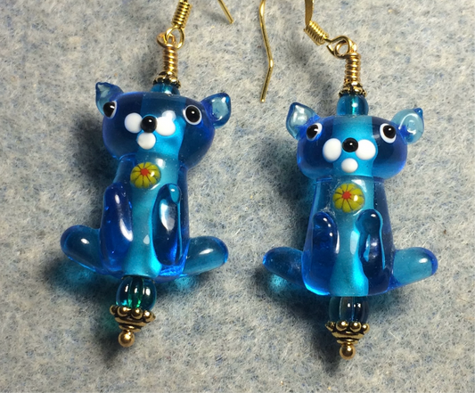 Translucent turquoise lamp work cat bead earrings adorned with turquoise Czech glass beads.