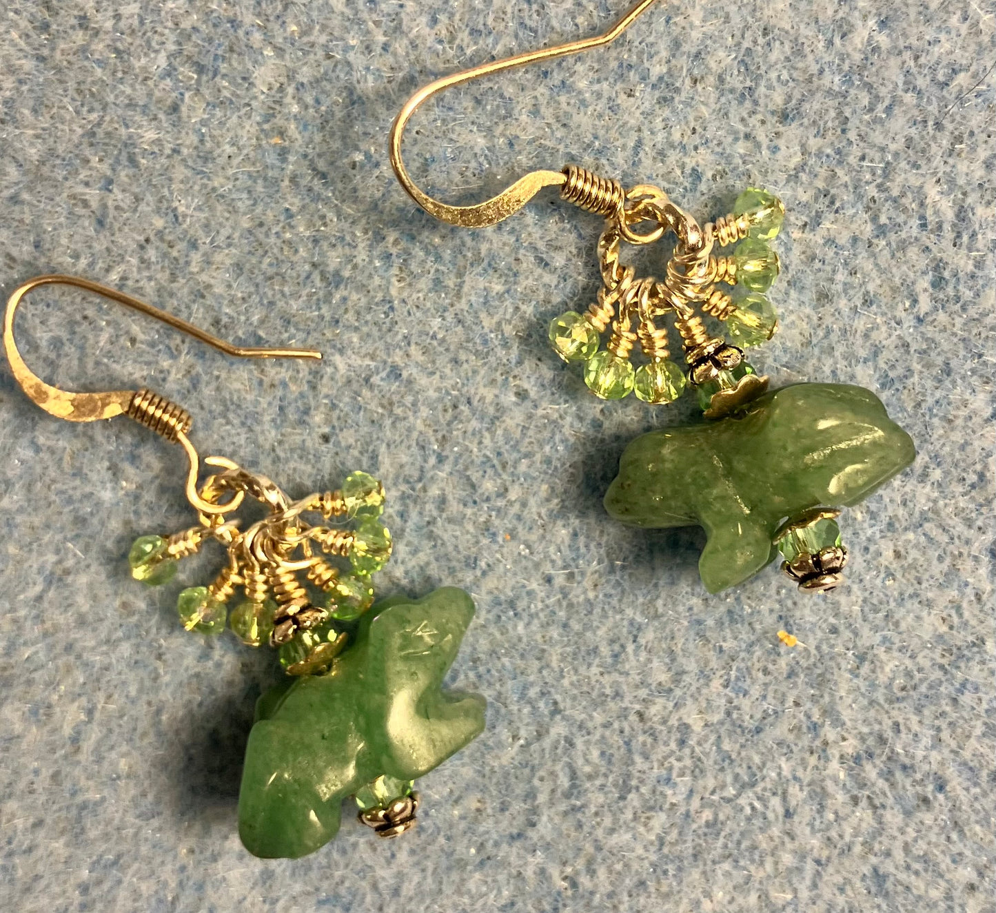 Small green aventurine gemstone frog bead earrings adorned with tiny dangling green Chinese crystal beads.