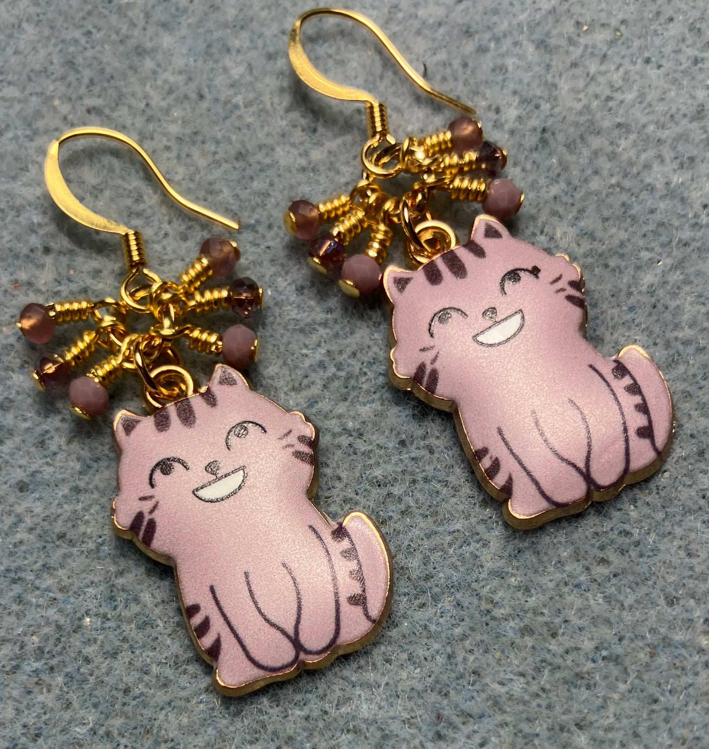 Lavender enamel cat charm earrings adorned with tiny dangling lavender Chinese crystal beads.