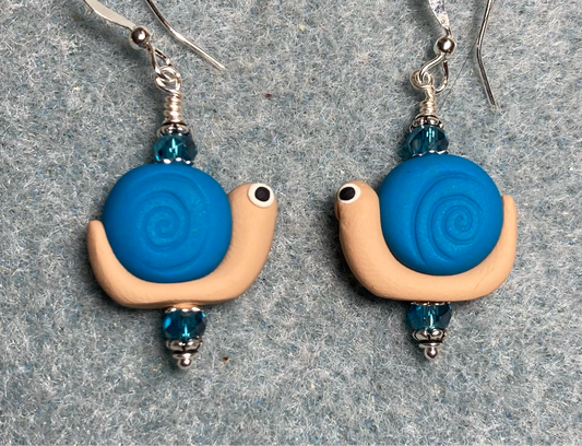 Turquoise and tan polymer clay snail bead earrings adorned with turquoise Chinese crystal beads.