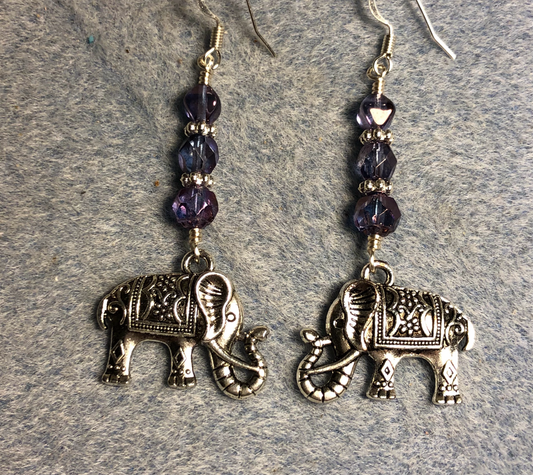 Ornate silver elephant charm earrings adorned with violet Czech glass beads.