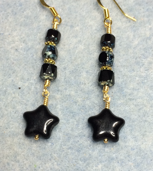 Small black Czech glass star bead earrings adorned with black Picasso Czech glass beads.