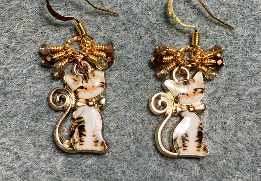 Brown, orange, and off white enamel cat charm earrings adorned with small brown and orange Chinese crystal beads.