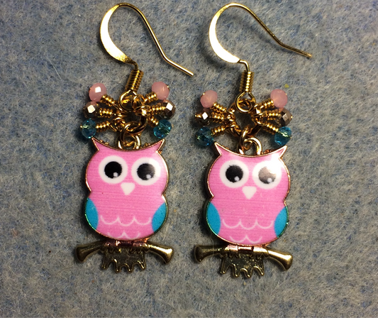 Pink, turquoise, and white enamel owl charm earrings adorned with tiny dangling pink, turquoise, and gold Chinese crystal beads.