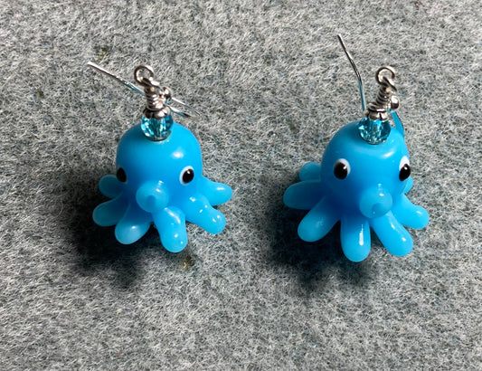 Turquoise lamp work octopus bead earrings adorned with turquoise Chinese crystal beads.